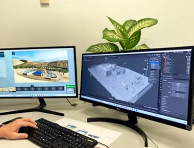 Puesto de trabajo con doble monitor y modelado 3D